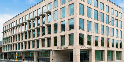 Five-story office building with "AerCap House" signage along the top of the entrcance.