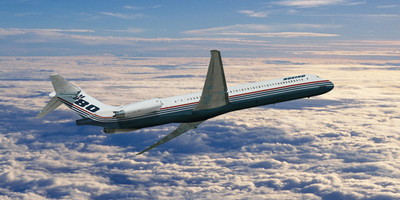 McDonnell Douglas MD-82 aircraft flying above the clouds.