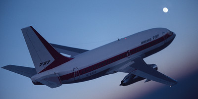 Boeing 737-204A flying through the sky.